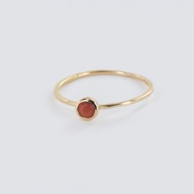 Ring with orange closed setting